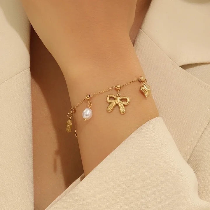 
                  
                    Charm Bow Bracelet
                  
                